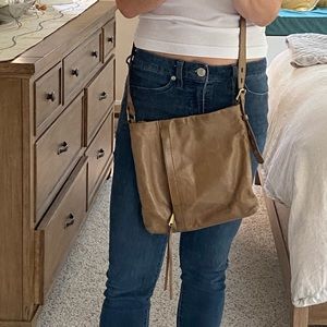 HOBO Crossbody 100% leather.  Aged beautifully soft.  Gorgeous tan. Adjustable